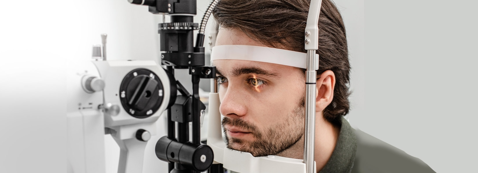 young man during eye exam in Rosana Square Shopping Center